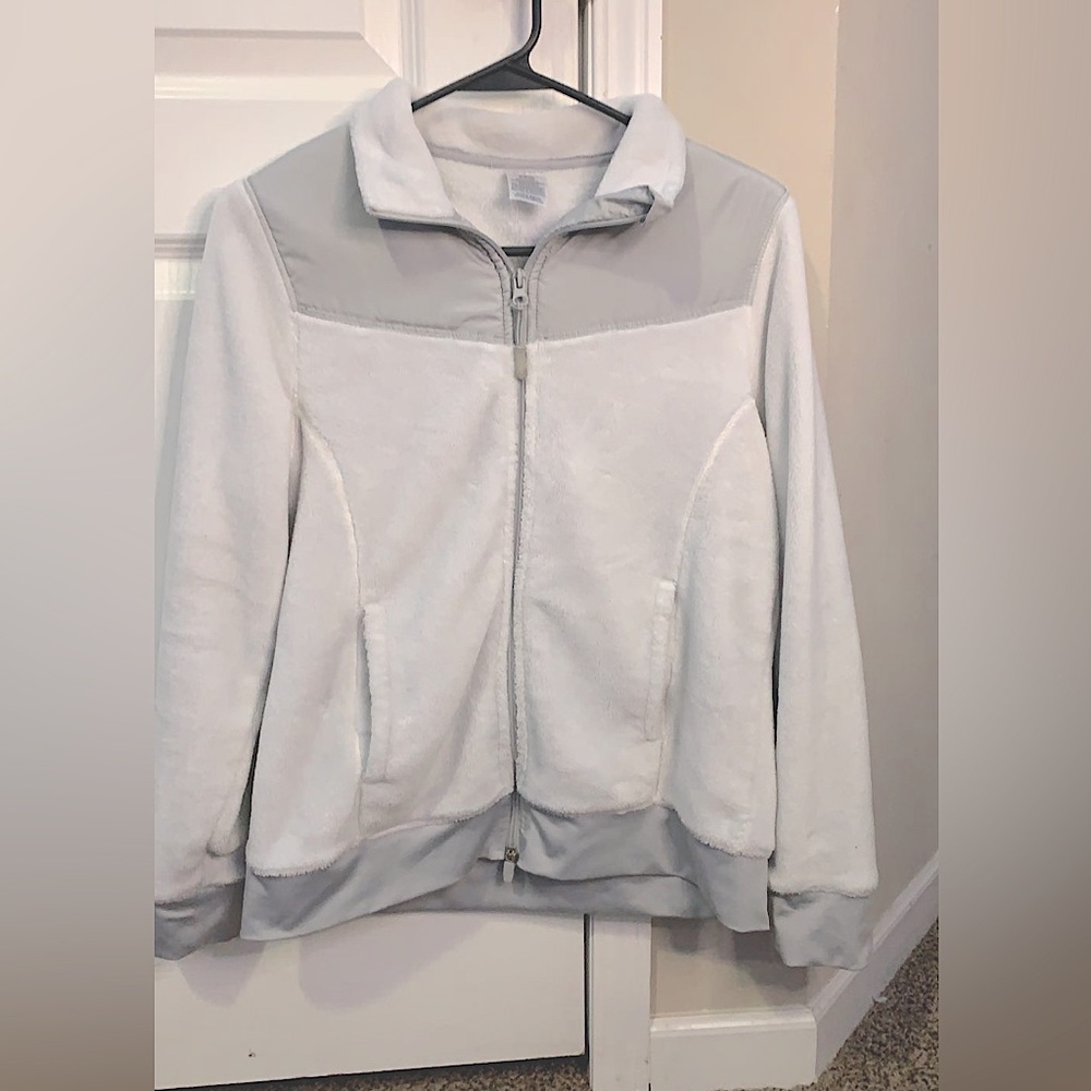 I am selling this warm fuzzy white jacket I only wore it two times